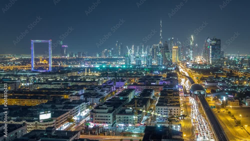 Dubai skyline with beautiful city center lights and Sheikh Zayed road traffic night timelapse. Illuminated towers and skyscrapers aerial view from zabeel district. Dubai, United Arab Emirates