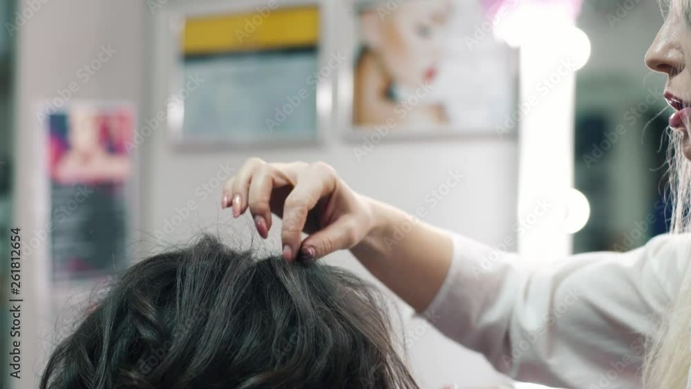 Hairdresser Does A Hairstyle To A Client Girl With A Hairbrush Hairdresser Does A Hairstyle To A Client Girl With A Hairbrush
