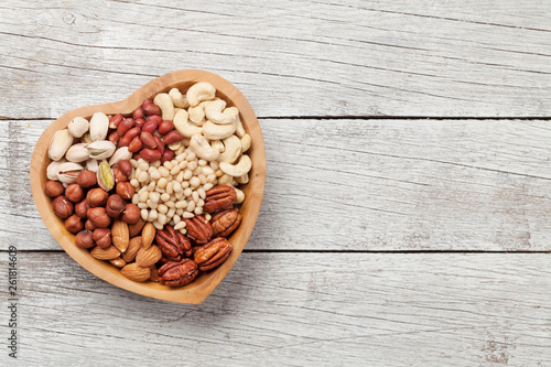 Various nuts selection on wooden table
