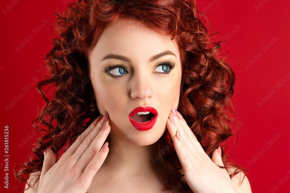 Fototapeta premium beautiful surprised woman with bright makeup and curls