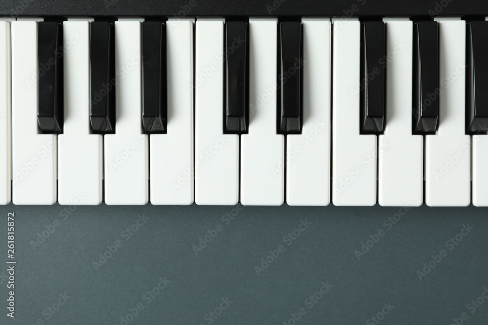 Piano keyboard on dark background, space for text Piano keyboard on dark background, space for text
