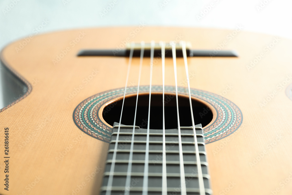Beautiful six - string classic guitar on white background, closeup Beautiful six - string classic guitar on white background, closeup