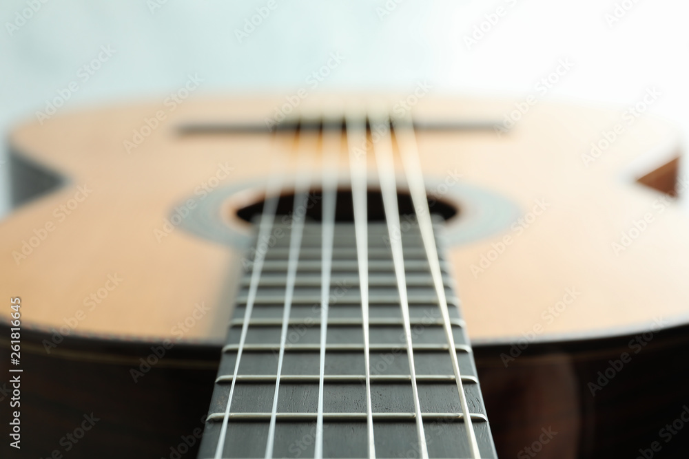 Obraz premium Beautiful six - string classic guitar on white background, closeup