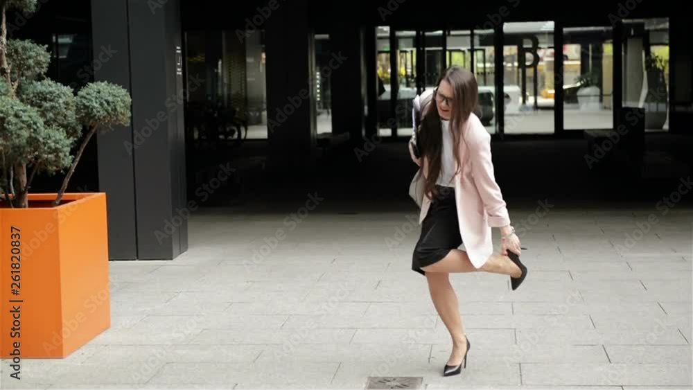 Young Businesswoman on High Heels Stumbled. Hard-Working Women Is Going To a Work Centre. Professional Concept. Young Businesswoman on High Heels Stumbled. Hard-Working Women Is Going To a Work Centre. Professional Concept.