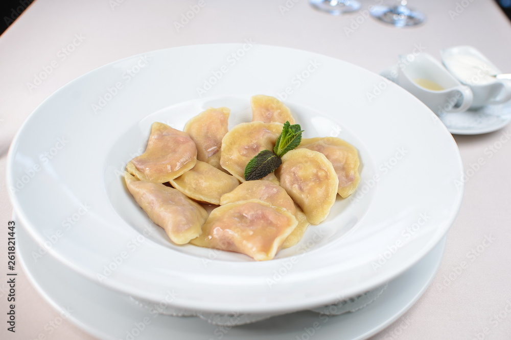 dumplings with strawberries on a white plate dumplings with strawberries on a white plate