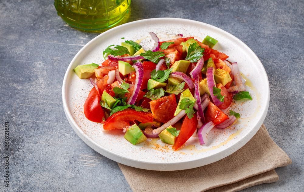Vegetarian salad with avocado, tomato and red onion Vegetarian salad with avocado, tomato and red onion