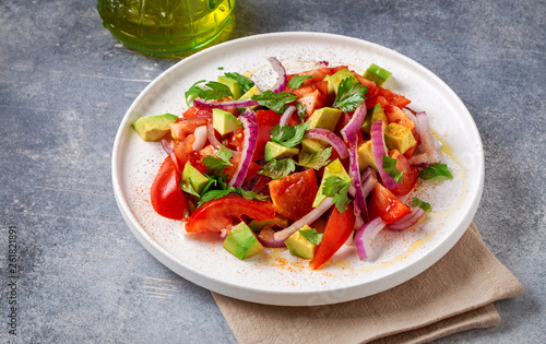 Vegetarian salad with avocado, tomato and red onion