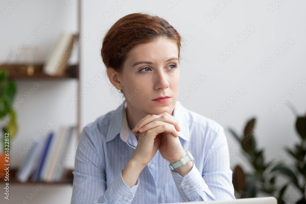 Thoughtful serious pensive businesswoman lost deep in thoughts at work Thoughtful serious pensive businesswoman lost deep in thoughts at work