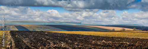 farm field lines of arable land landscape at spring time
