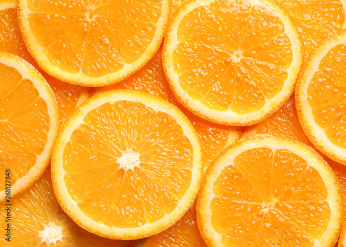 Juicy orange slices as background  top view. Citrus fruit