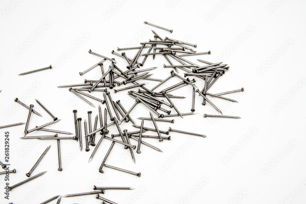Bunch of metal nails on white background