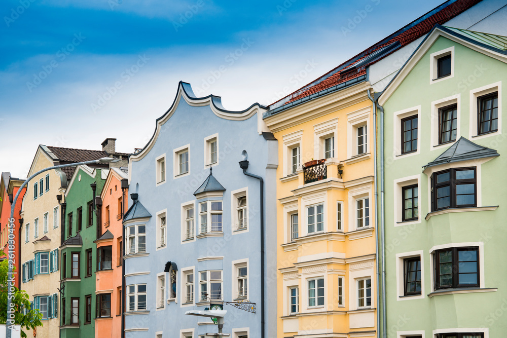 Obraz premium colorfull houses, church tower, bridge, along river Inn, Innsbruck, Austria
