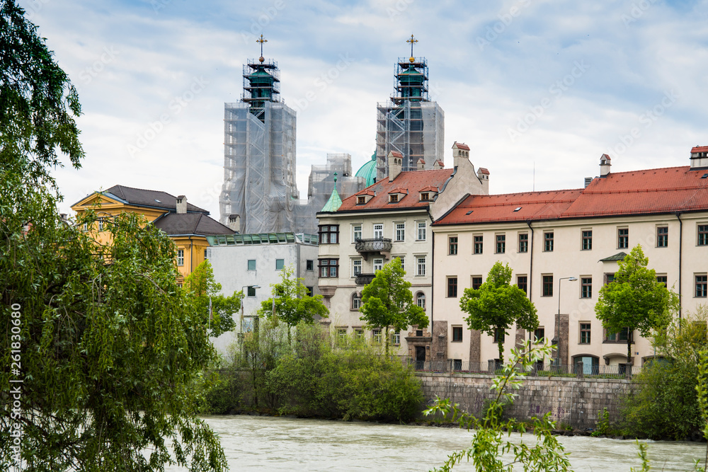 colorfull houses, church tower, bridge, along river Inn, Innsbruck, Austria