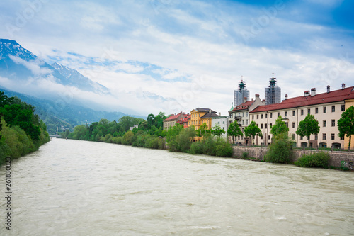 colorfull houses, church tower, bridge, along river Inn, Innsbruck, Austria photo