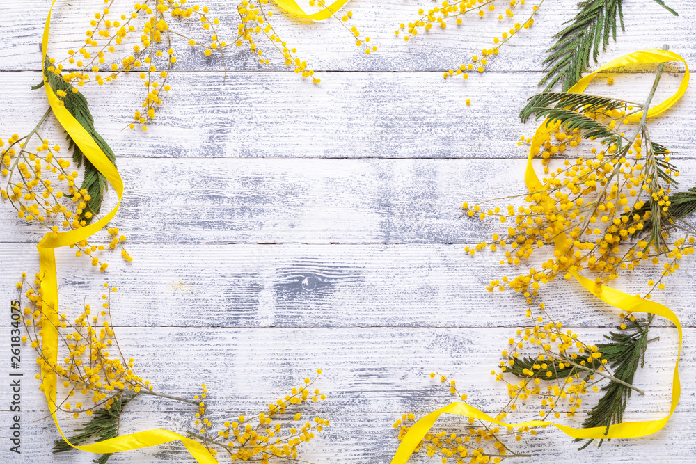Mimosa flowers on a wooden table Frame Mimosa flowers on a wooden table Frame