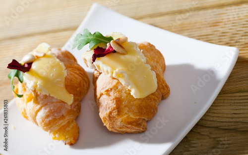 Croissant with Camembert and pine nuts