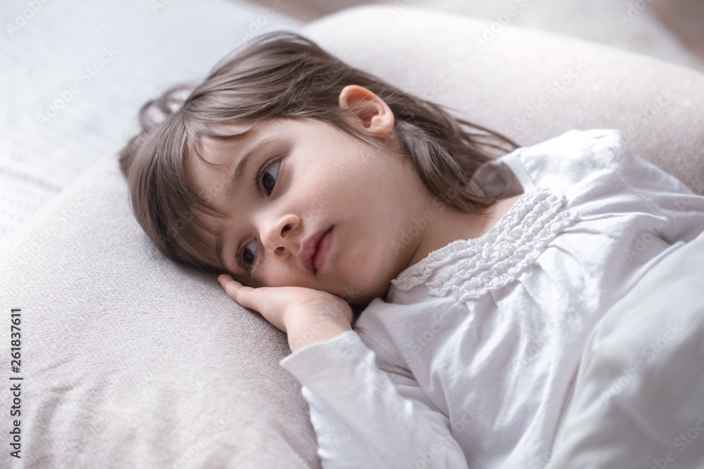 Little cute girl sad in bed , sleep concept Little cute girl sad in bed , sleep concept