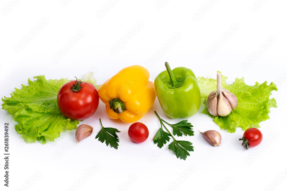 Cherry tomatoes with greens and sweet peppers on a white background. Green pepper and yellow with tomatoes and herbs on a white background. Cherry tomatoes with greens and sweet peppers on a white background. Green pepper and yellow with tomatoes and herbs on a white background.