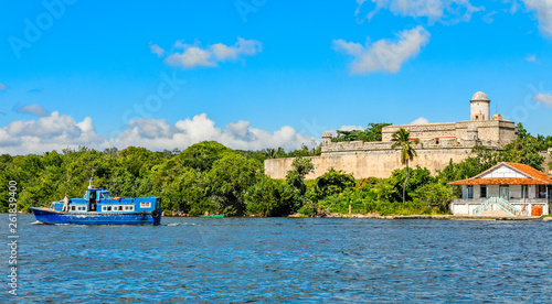 Fényképezés Jagua castle fortified walls with trees and fishing boats in the foreground, Cie