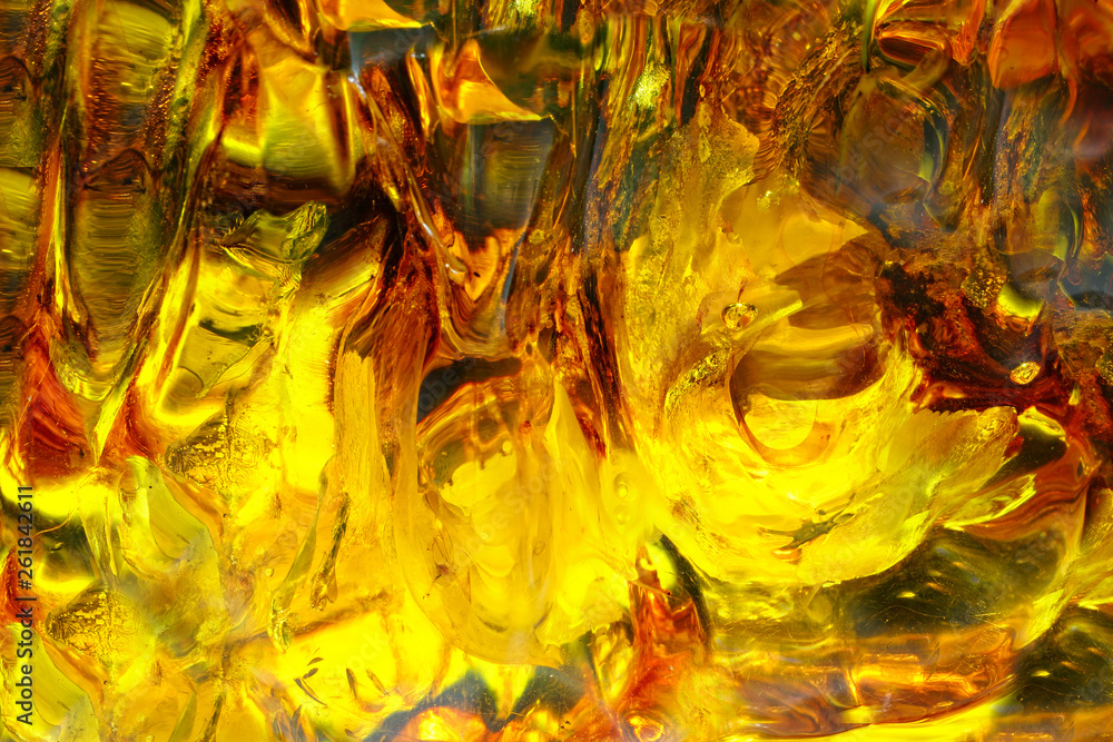 Amber. Beautiful colored amber background. Amber texture. Red-yellow