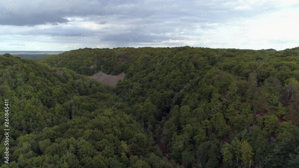 Aerial view of valley in national park in Southern Sweden, Skåne landscape. Drone shot flying over forest mountains. Nature background in 4K resolution Aerial view of valley in national park in Southern Sweden, Skåne landscape. Drone shot flying over forest mountains. Nature background in 4K resolution