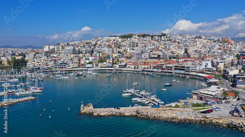 Aerial drone bird s eye view panoramic photo of iconic round shaped picturesque port of Mikrolimano with sail boats and yachts docked and beautiful clouds  Piraeus port  Attica  Greece
