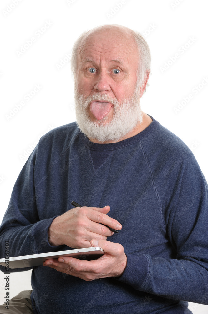 Funny old man with tongue sticking out using tablet computer isolated on  white Stock Photo | Adobe Stock