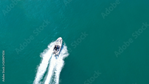Aerial top view of speed boat cruising in mediterranean open sea © aerial-drone