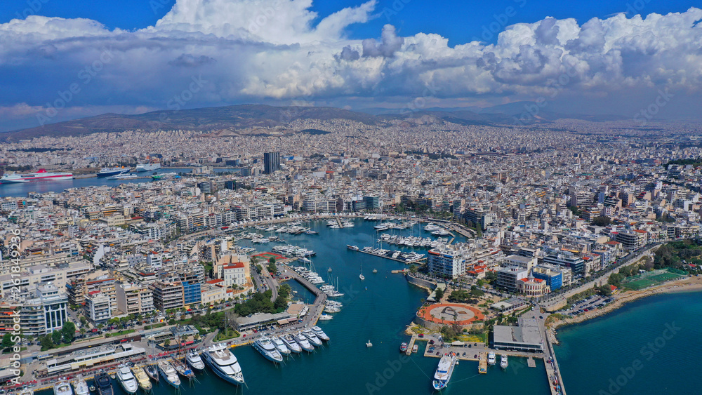 Aerial drone panoramic photo of iconic port of Marina Zeas or Pasalimani with yachts and sail boats docked and beautiful blue sky - clouds, port of Piraeus, Attica, Greece