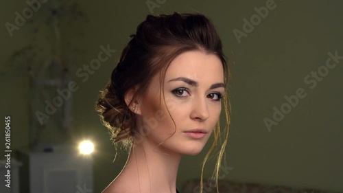 Beautiful girl looking to the camera. Brown eyes, sensual lips, perfect skin.