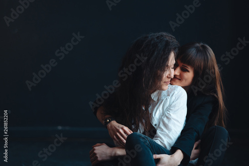 Two girls in each other's tender embraces