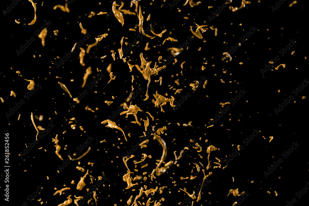 abstract golden liquid splash on black background abstract golden liquid splash on black background