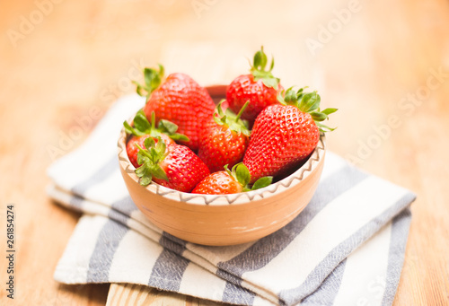 Fresh strawberries on ceramic bowl 
