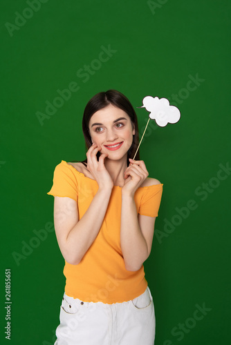Dreamful smiling girl with paper sample of ideas © Yakobchuk Olena