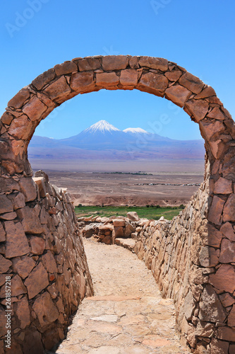 Arch and volcano in Atacama  Vertical