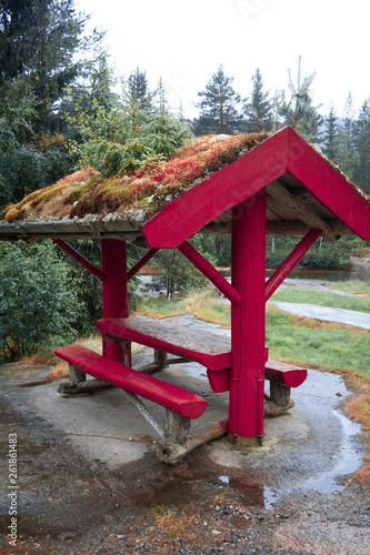 arbor on background of spellbinding landscape of Norwegian nature with high charming mountains and hills