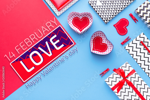 Person holding a present for Saint Valentine's day in his hands. Beautiful colorful background to st. Valentine day. Greeting card with red hearts. Wedding's invitation. Love expression. 