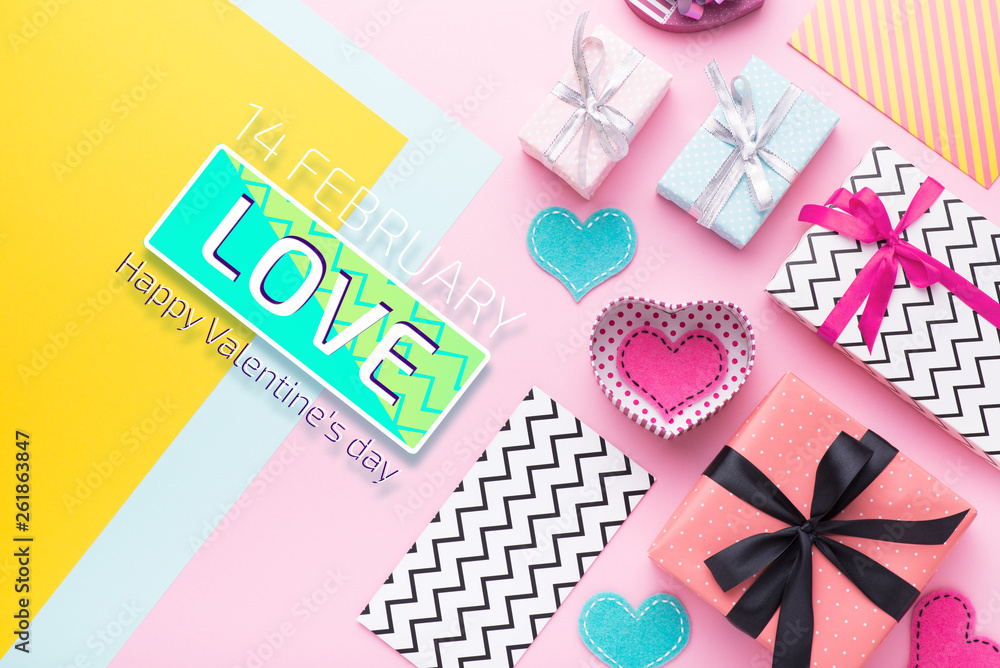 Person holding a present for Saint Valentine's day in his hands. Beautiful colorful background to st. Valentine day. Greeting card with red hearts. Wedding's invitation. Love expression. Person holding a present for Saint Valentine's day in his hands. Beautiful colorful background to st. Valentine day. Greeting card with red hearts. Wedding's invitation. Love expression.