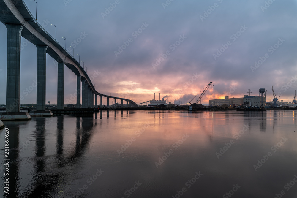 The massive Jordan Bridge over the Elizabeth River in Virginia, reflecting in the water at sunset, in high resolution