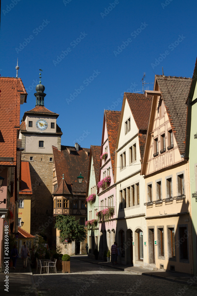 Fototapeta premium Rothenburg ob der Tauber, Germany - Aug 23, 2016: Beautiful view of the famous historic town of Rothenburg ob der Tauber on romantic road, on a sunny day in summer, Franconia, Bavaria, Germany
