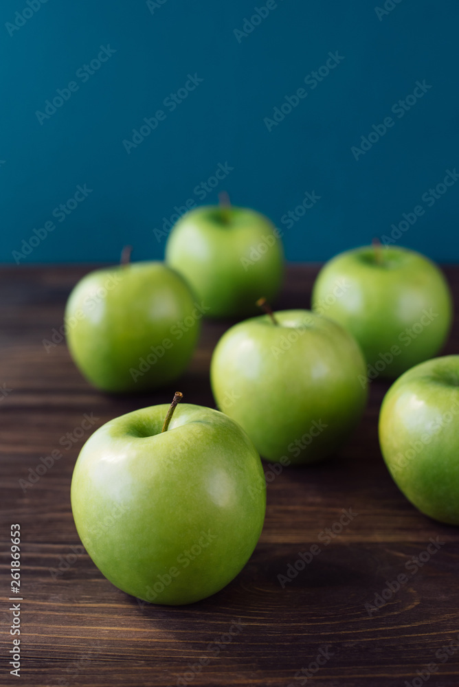 Group of green apples on brown wooden background. Close up Group of green apples on brown wooden background. Close up