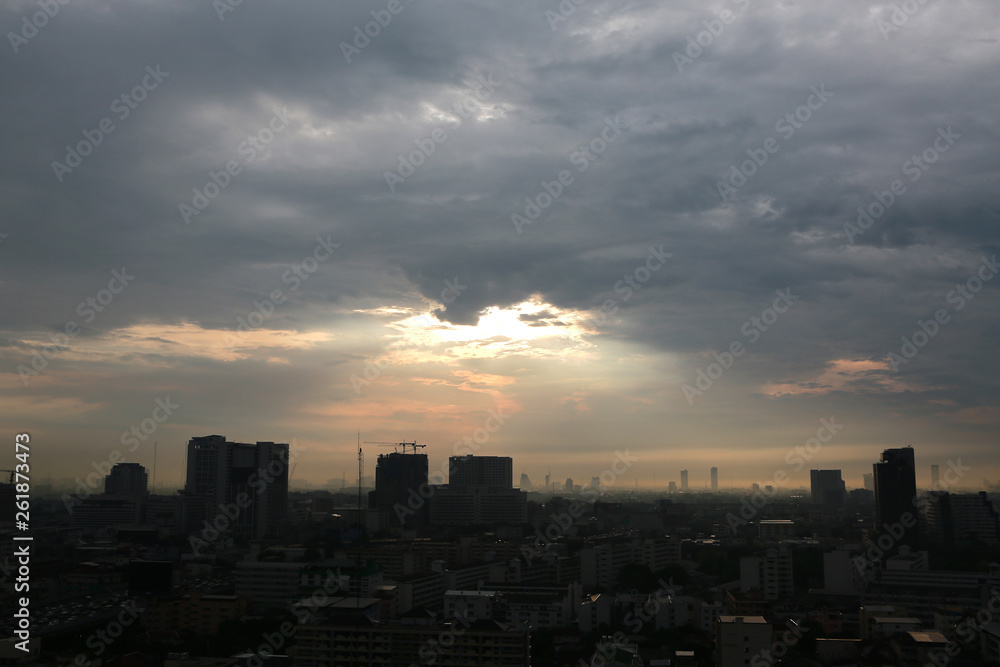 Fototapeta premium Silhouette City downtown with sunset and clouds background in the evening.