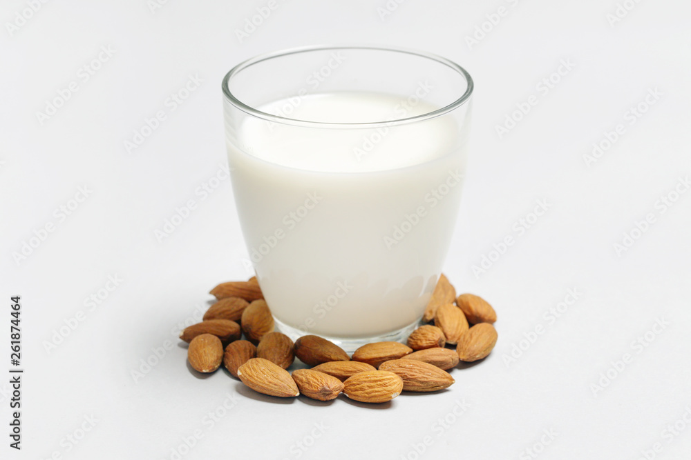 Almond milk and nuts. Organic vegan non-dairy plant-based milk in a glass. Almond milk and nuts. Organic vegan non-dairy plant-based milk in a glass.