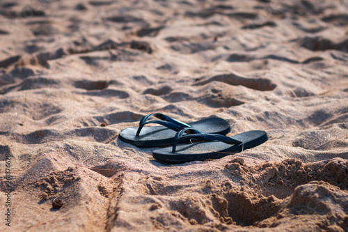 Pair of sandals on a beach