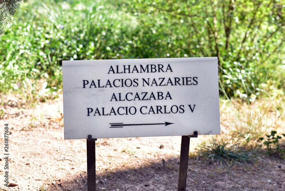 Sign showing the way to Carlos Palace in Alhambra, Granada, Spain