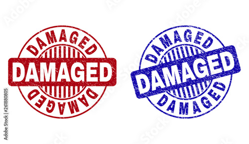 Grunge DAMAGED round stamp seals isolated on a white background. Round seals with grunge texture in red and blue colors. Vector rubber overlay of DAMAGED label inside circle form with stripes.