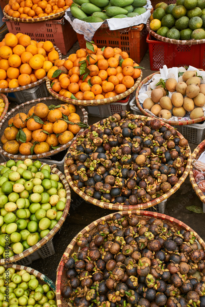 Exotic street market with many tropical fruit