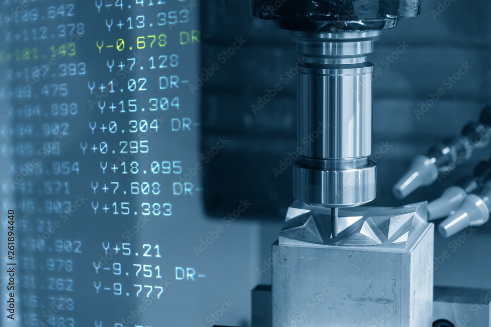 The abstract scene of 3-axis CNC machining centre and the G-code data cutting the injection mold part.The hi-precision CNC milling machine. The abstract scene of 3-axis CNC machining centre and the G-code data cutting the injection mold part.The hi-precision CNC milling machine.