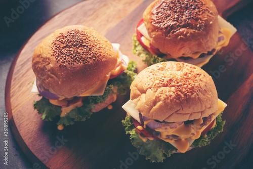 beef burgers on wood plate