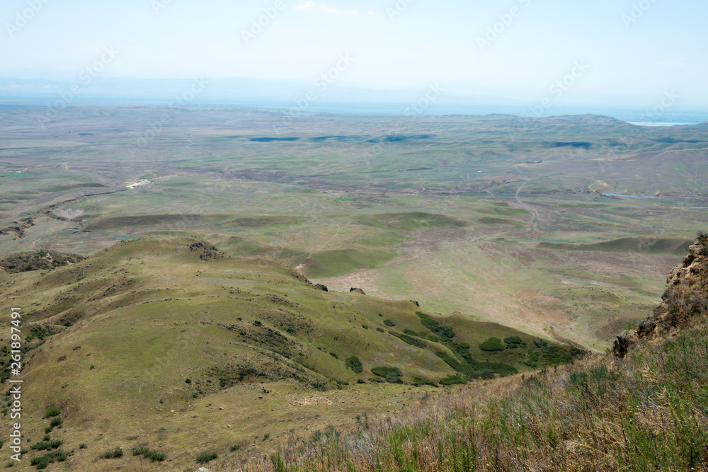 Kakheti, Georgia - Jul 20 2018: Azerbaijan View from David Gareja monastery complex. a famous historic site in Kakheti, Georgia. Kakheti, Georgia - Jul 20 2018: Azerbaijan View from David Gareja monastery complex. a famous historic site in Kakheti, Georgia.